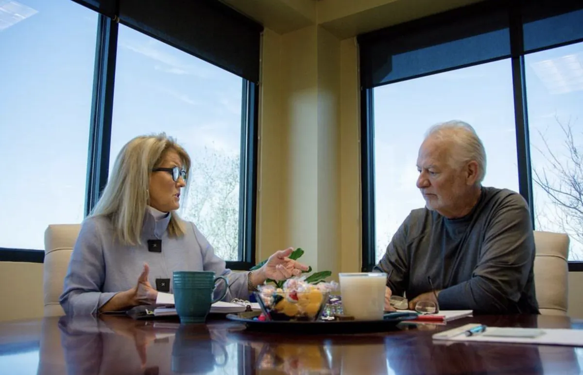 Erin Thrash meeting with a client at the conference table in the Lakeway office